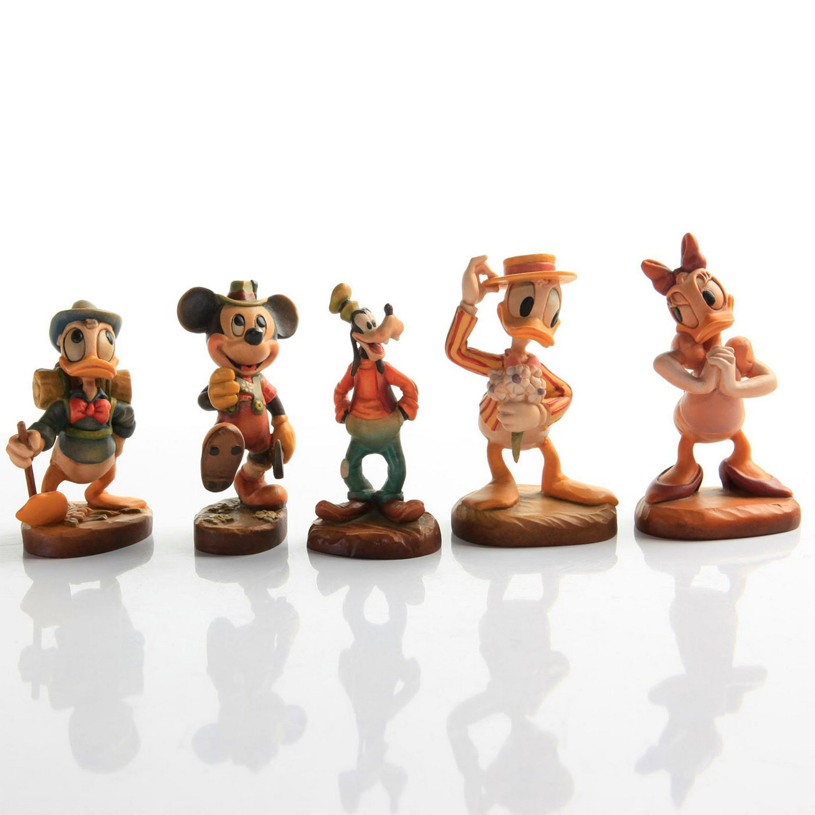 5 ANRI CARVED WOOD DISNEY FIGURINES: Disney cartoon characters. 4 original boxes. Issued: 20th c. Dimensions: 4.5"H, tallest Manufacturer: Anri Country of Origin: Italy