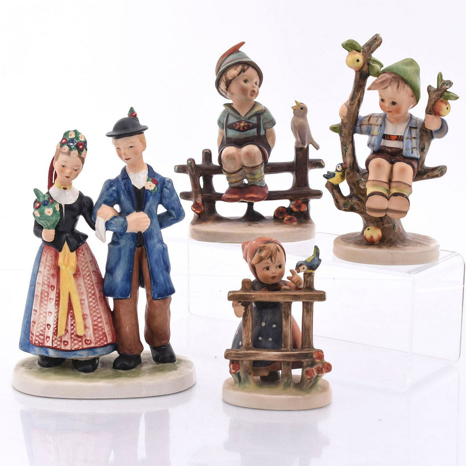4 GOEBEL, HUMMEL FIGURINES: 3 Hummel figures; Goebel Hahn 501. Maker's mark on the underside. Issued: 20th c. Dimensions: 7.5"H, tallest Manufacturer: Goebel Country of Origin: Germany