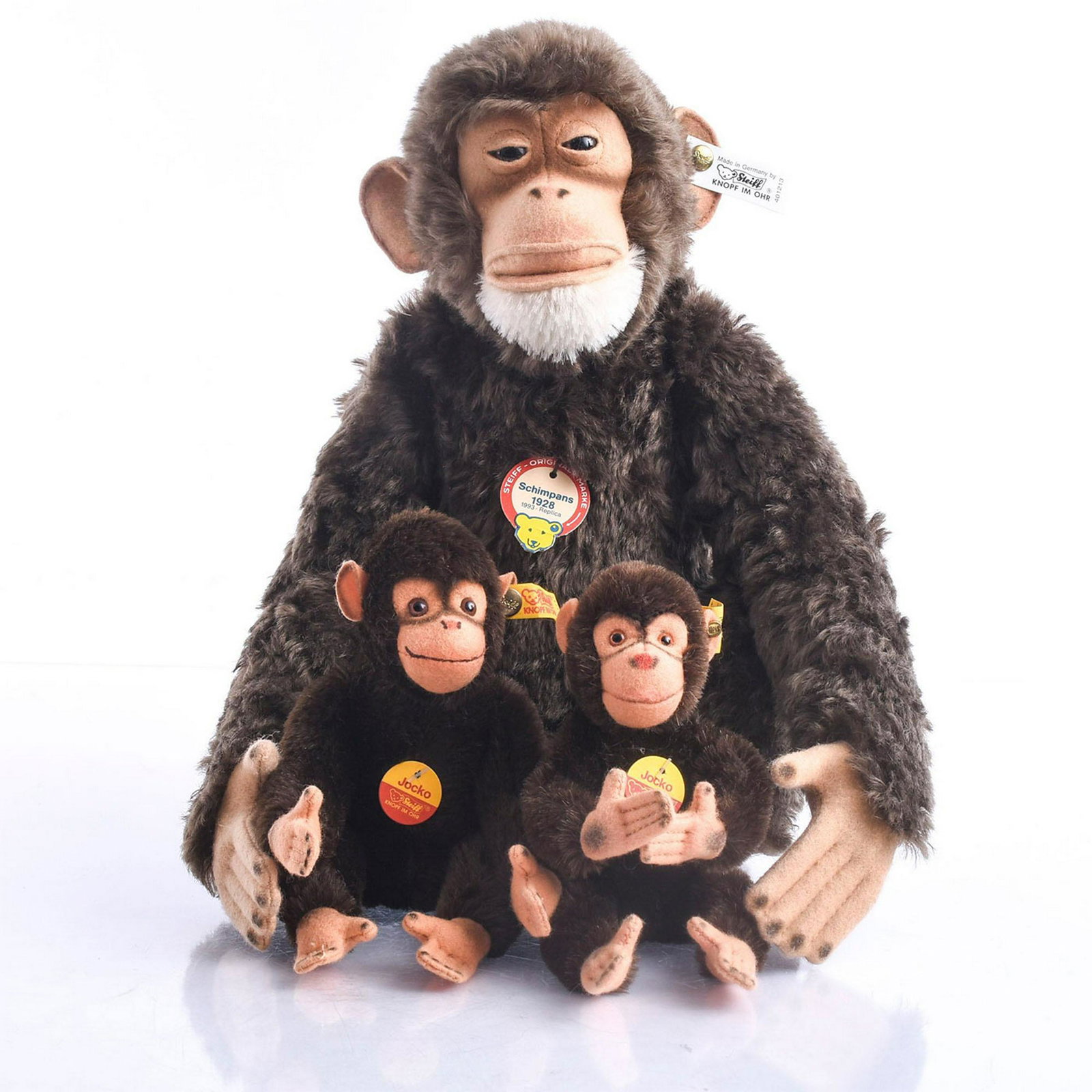 3 STEIFF MONKEYS, ARTICULATED/WIRE ARTICULATED: Schimpans 1928 replica, and 2 small Jocko monkeys. Ear buttons and chest tag, mohair. Issued: 20th c. Dimensions: 11"H x 11"W Manufacturer: Steiff Country of Origin: Germany