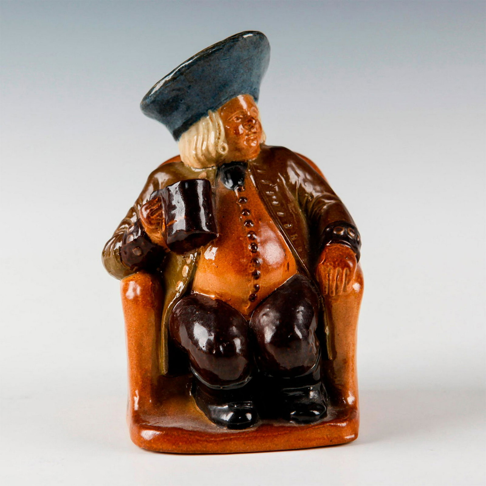 DOULTON LAMBETH ARMCHAIR TOBY JUG BY HARRY SIMEON: Art Deco advertising ware, produced as an ashpot. A rare Doulton Lambeth Toby Jug, produced as an advertising piece for YE OLDE COCK TAVERN 22 FLEET STREET FOUNDED 1549. Stamped to base ROYAL DOULTON 