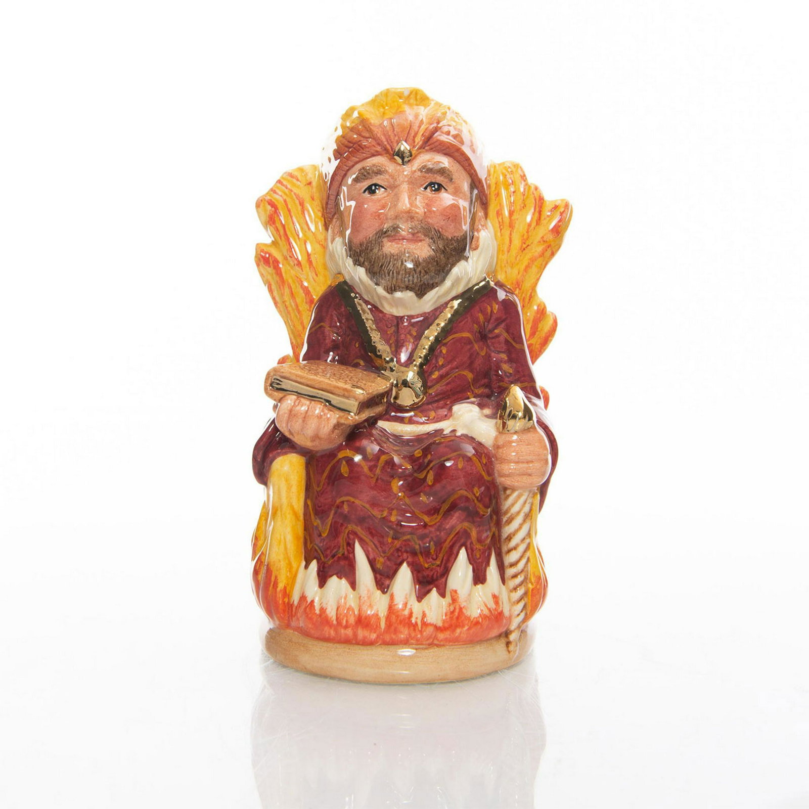 ROYAL DOULTON TOBY JUG, THE FIRE KING D7070: Robed man sitting on throne of flames. Title of jug, edition information, and Royal Doulton backstamp on bottom. Hand signed by Michael Doulton. Artist: Martyn C.R. Alcock Issued: 1998 Dimensions: 5"H