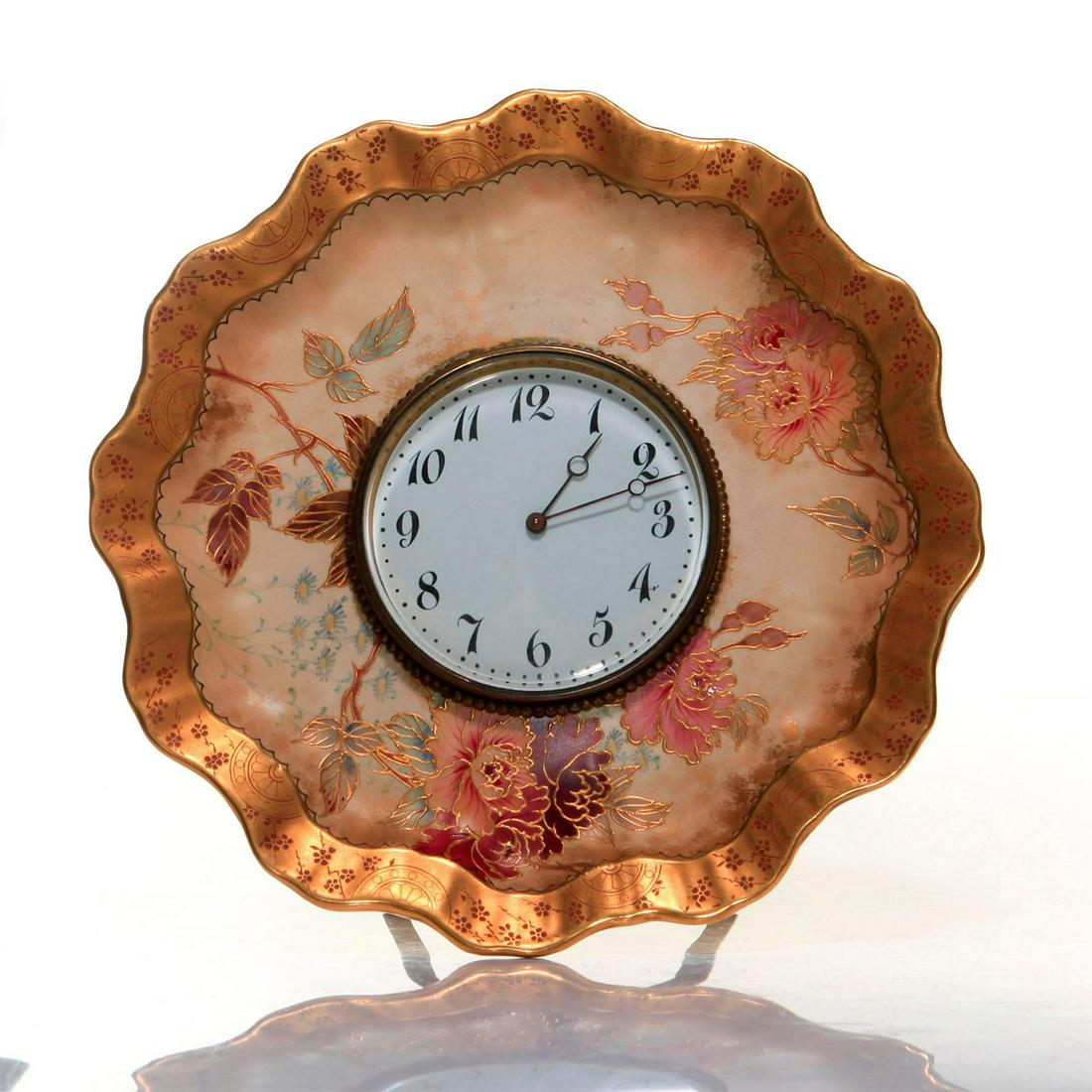 RARE DOULTON BURSLEM SPANISHWARE MANTEL CLOCK: Movement marked E.G.L, key wound, jeweled lever escapement. Extremely unique gilded Burslem ware mantle clock rendered as a charger with floral decor on vellum bisque, with an original brass and bronz