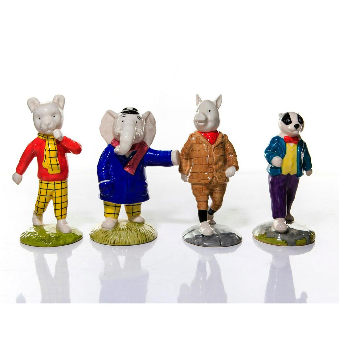 ROYAL DOULTON BESWICK RUPERT BEAR CARTOON FIGURINES: Limited ed. of 1920 figurines to commemorate the British cartoon. A group of four figurines produced by Beswick for Royal Doulton modeled as characters from the 1920s comic strip Rupert Bear: RUPERT B