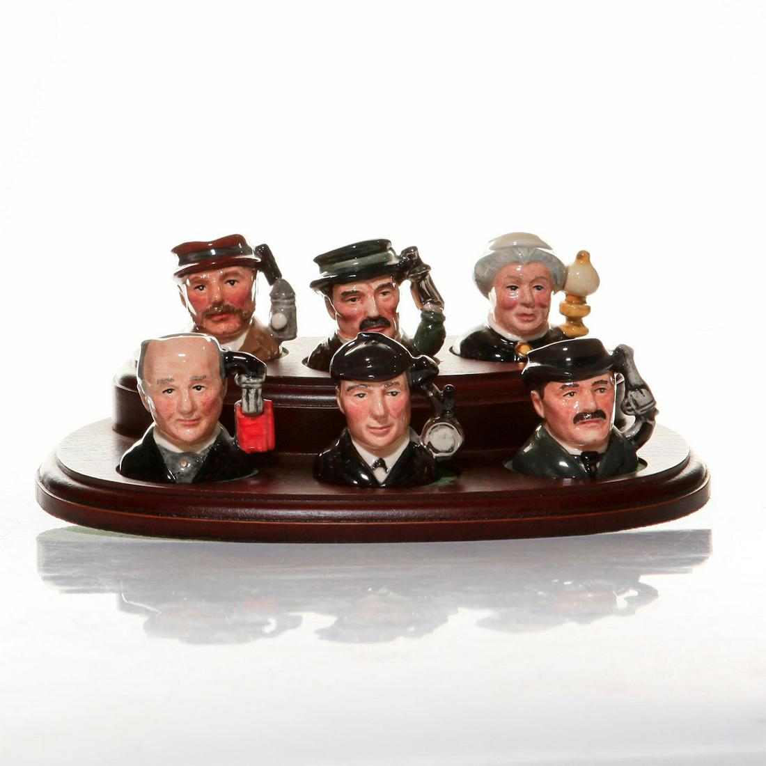 ROYAL DOULTON, SHERLOCK HOLMES, TOBY MINIATURE JUGS: 6 Limited edition of 2500 sets, with presentation stand. D7011-7016. Issued: 20th c. Dimensions: 10"H, tallest Manufacturer: Royal Doulton Country of Origin: England