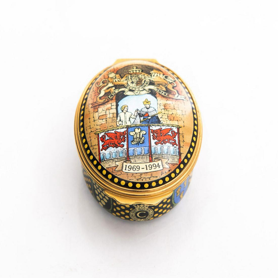 HALCYON DAYS ENAMEL TRINKET BOX, INVESTITURE: 25th anniversary of HRH Prince of Wales. Enameled on copper. 2"W. At Caernarfon Castle. In original box with Certificate of Authenticity. Issued: 20th c. Dimensions: 4.5"L x 3"W Manufacturer: Bilston