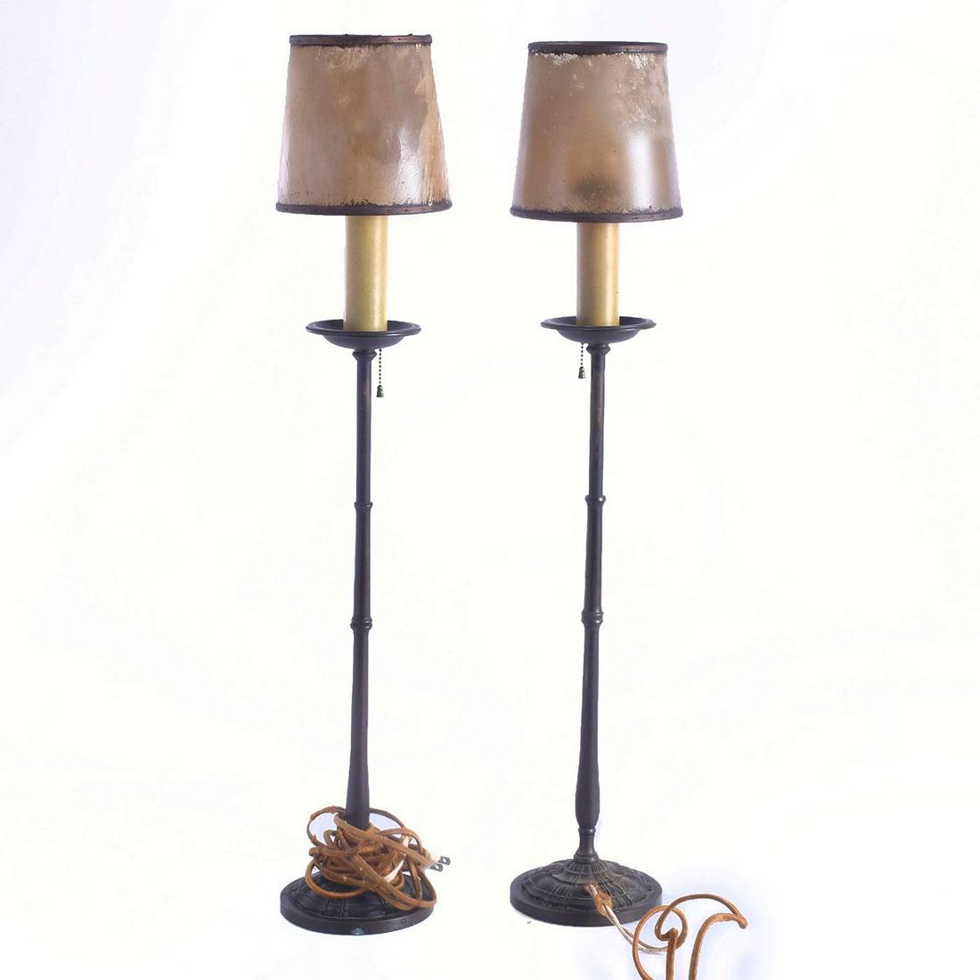 2 SLIM GOTHIC STYLE BRONZE LAMPS WITH RAWHIDE SHADES: Pair of vintage table pieces with cloth chord, metal bodies. Issued: 20th c. Dimensions: 26"H, with shades