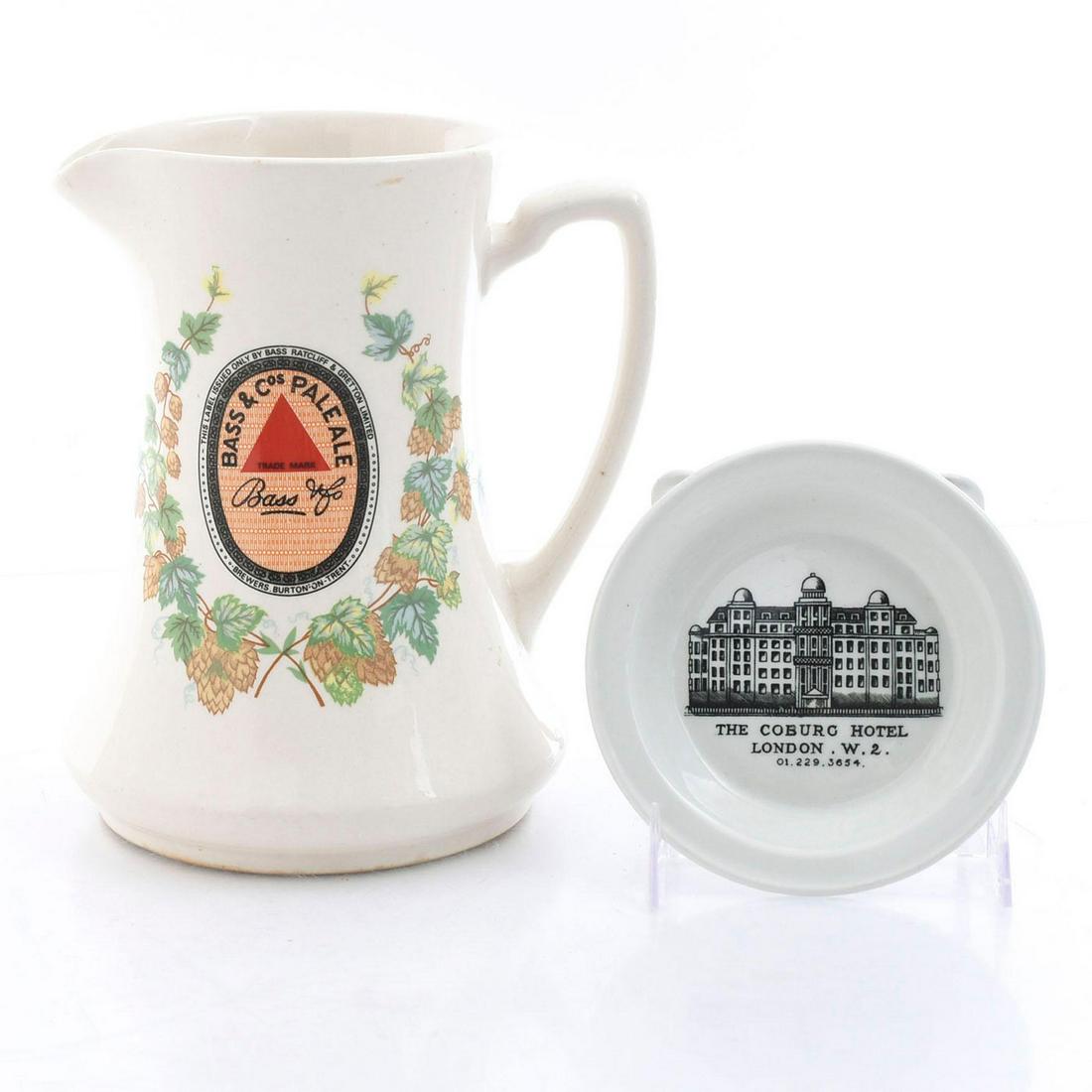 ADVERTISING WARE BASS ALE JUG, COBURG DISH: Stoneware, stamped by Royal Doulton, Beswick. A group of advertising ware pieces. Hand decorated white stoneware. The Beswick Bass Ale jug is reproduced from a 1910 original produced by Minton. Stampe