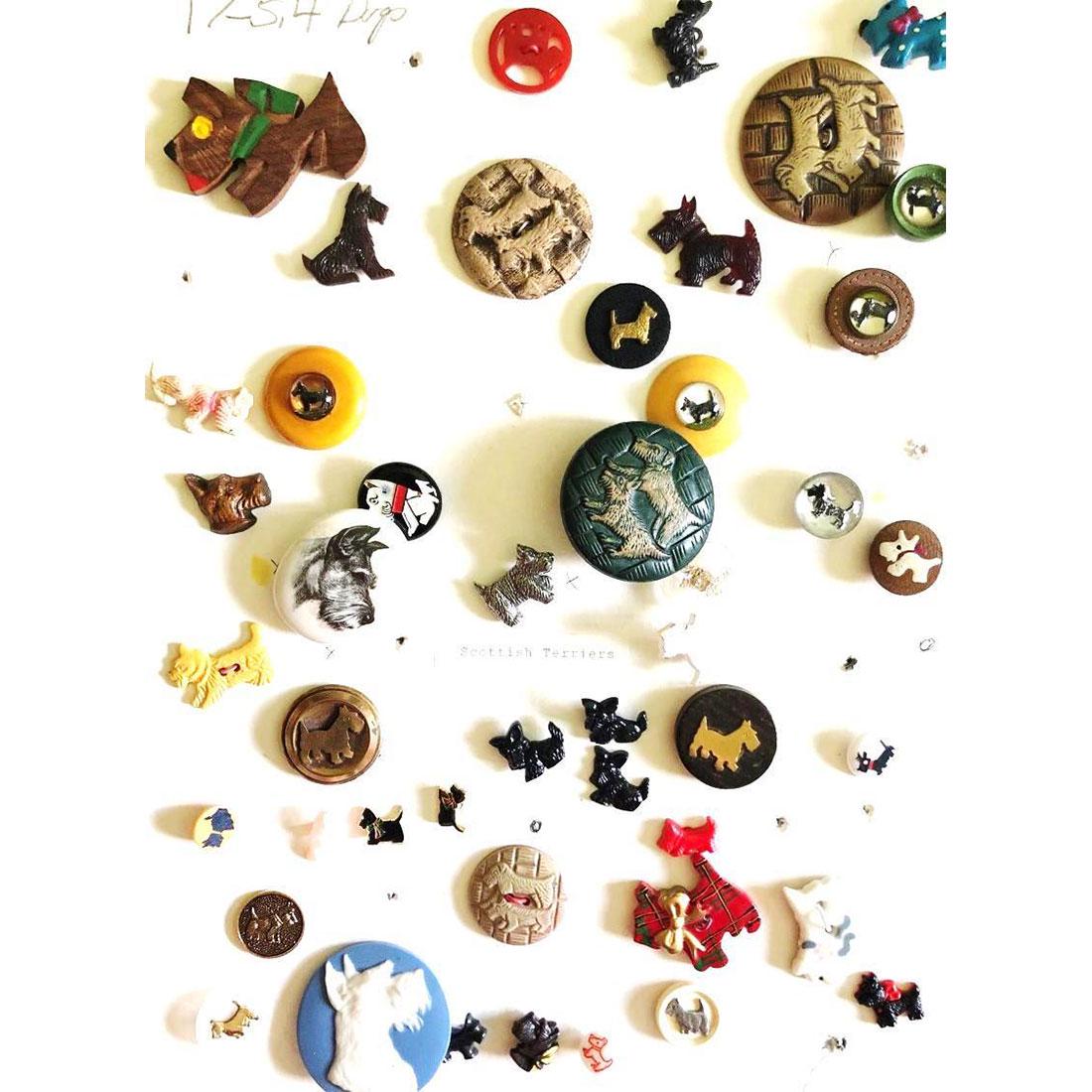 2 CARDS OF DOG BUTTONS IN ASSORTED MATERIALS: Over 80 Dog buttons-assorted materials to include Scottie Dogs in Bakelite, Jasperware, wood, plastic, metal and more. This lot also includes a card of 34 other dogs assorted.
