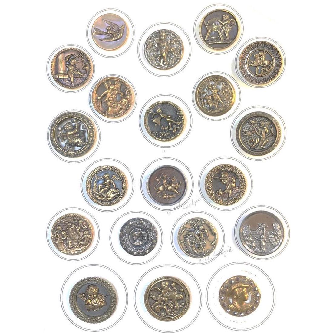 CARD OF MOSTLY CHERUB/CUPID ASSORTED METAL BUTTONS: 20 Large assorted metal specialized to Cherub/Cupid buttons. The lot includes cut steel OME, Pewter, pierced brass, a scarce large Victorian celluloid background, screen background, steel cup, and mor