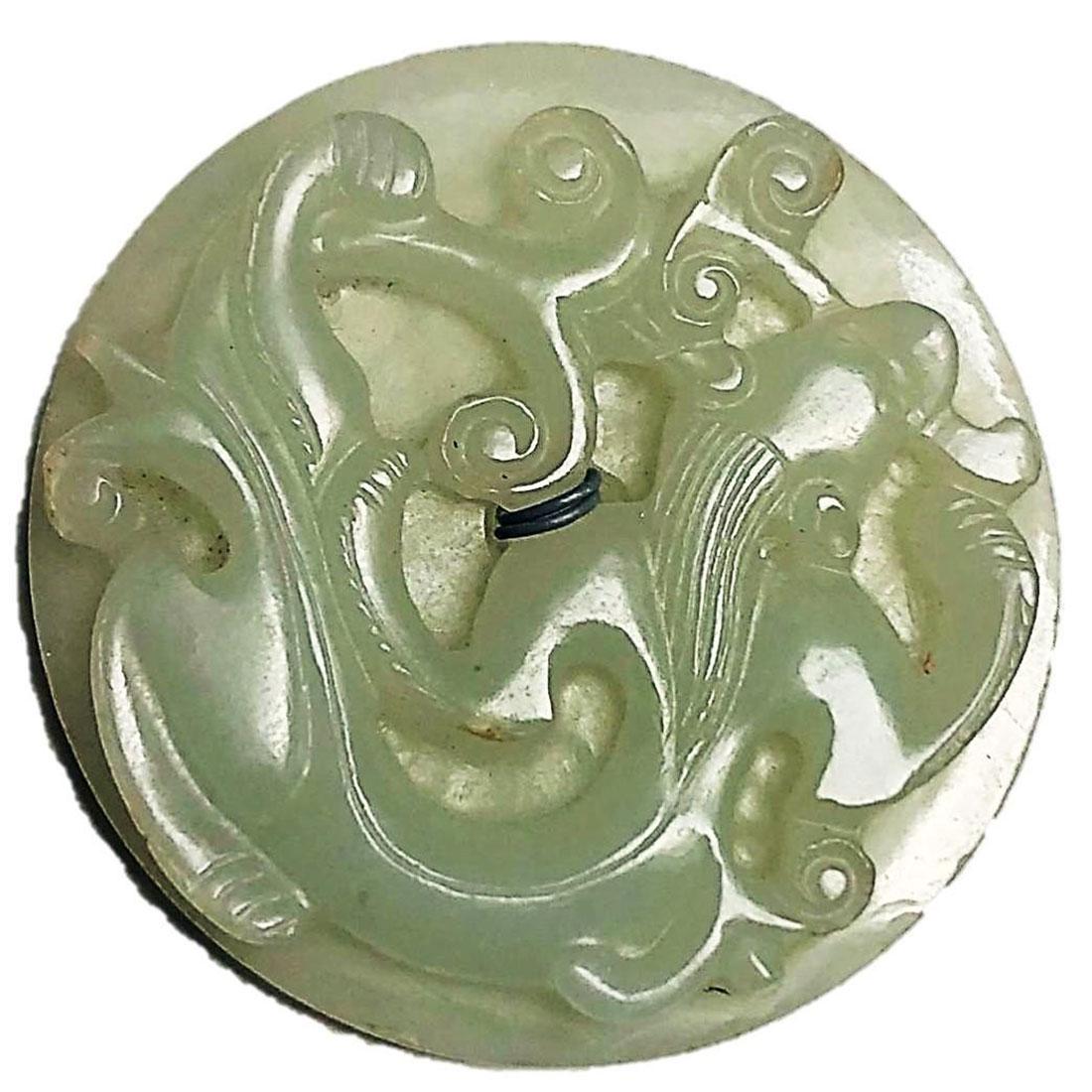 1 EXTRA LARGE 18TH C. MUTTON FAT JADE SEW THRU BUTTON: A very large and thick early Mutton Fat Jade button from China. This sew thru button dates to as early as the 18th century and is very well carved and detailed. A nice unusual find in buttons. These a