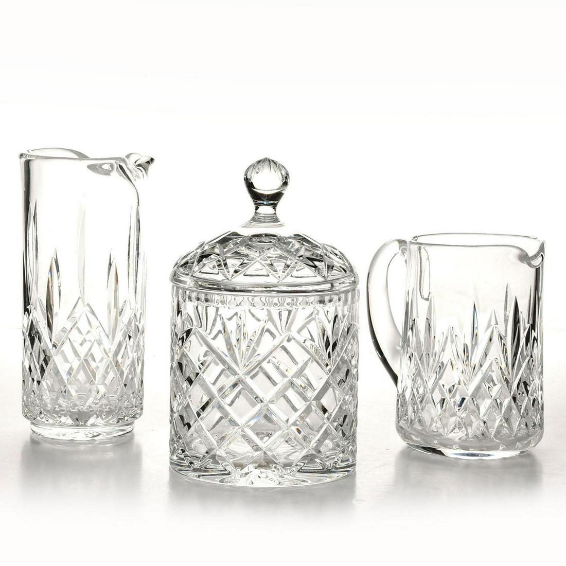 WATERFORD CRYSTAL; 2 MARTINI PITCHERS, ICE BUCKET: Barware pieces, including lidded bucket and two cocktail beakers. Beaker Shaker 8.5"H x 4"W; Handled Pitcher 6.25"H x 6.75"W; Ice Bucket 5.25"H x 5.25"W. Issued: c. 1990 Dimensions: 8.5"H x 4"W, large