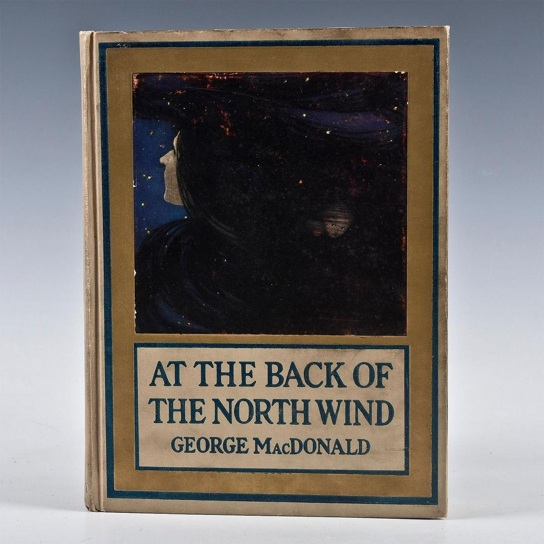 AT THE BACK OF THE NORTH WIND BOOK BY GEORGE MACDONALD: Tan illustrated cover, gilt. DJ. 8 color plates. 1st J.W. Smith edition. Artist: Jessie Willcox Smith Issued: 1919 Dimensions: 9.75"L Country of Origin: United States