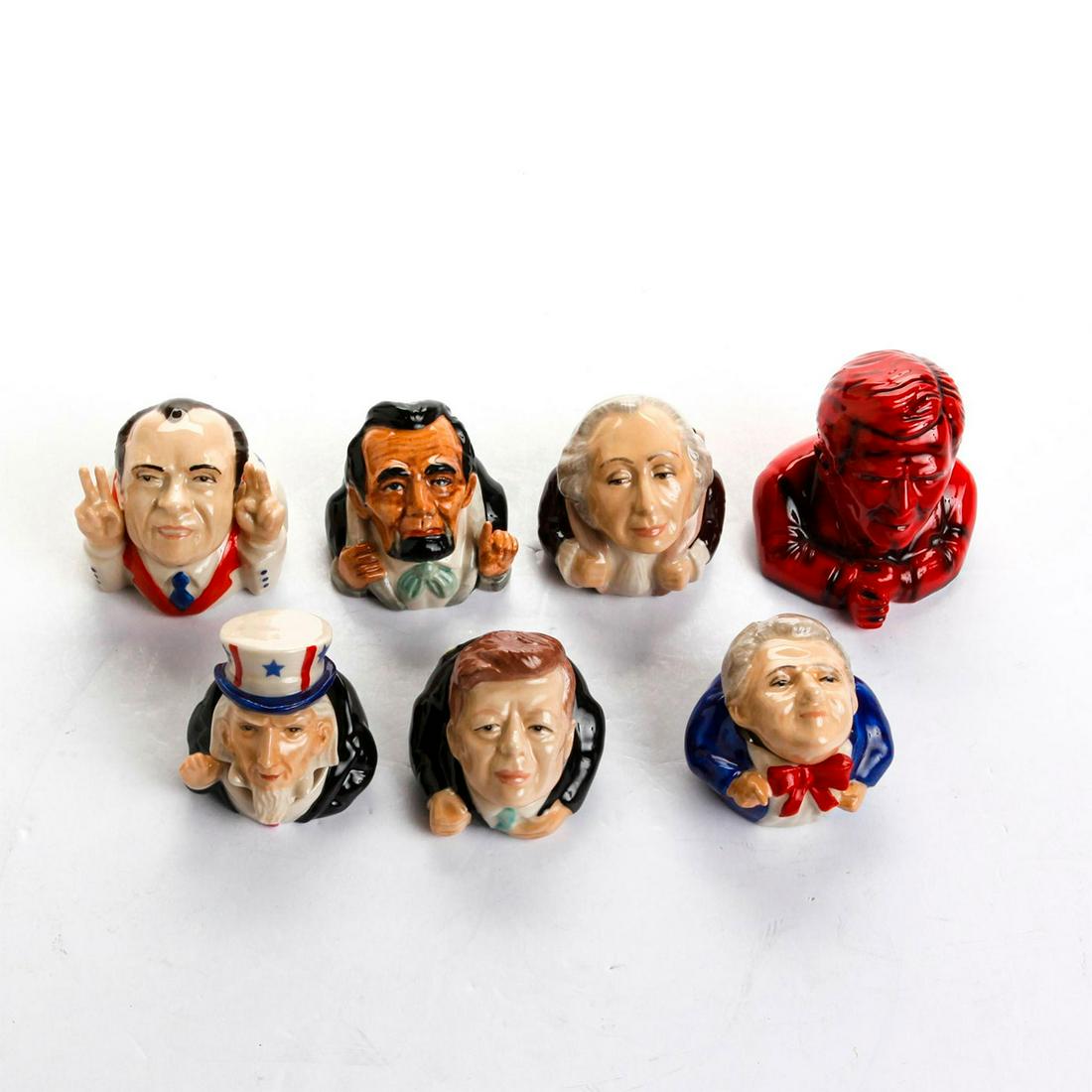 7 KEVIN FRANCIS CHARACTER FACE POTS: Lincoln, Bush, Washington, Kennedy, Clinton, Nixon, Uncle Sam. Marked Kevin Francis on bottom. Issued: 20th c. Dimensions: 3"H, tallest Manufacturer: Kevin Francis Country of Origin: England