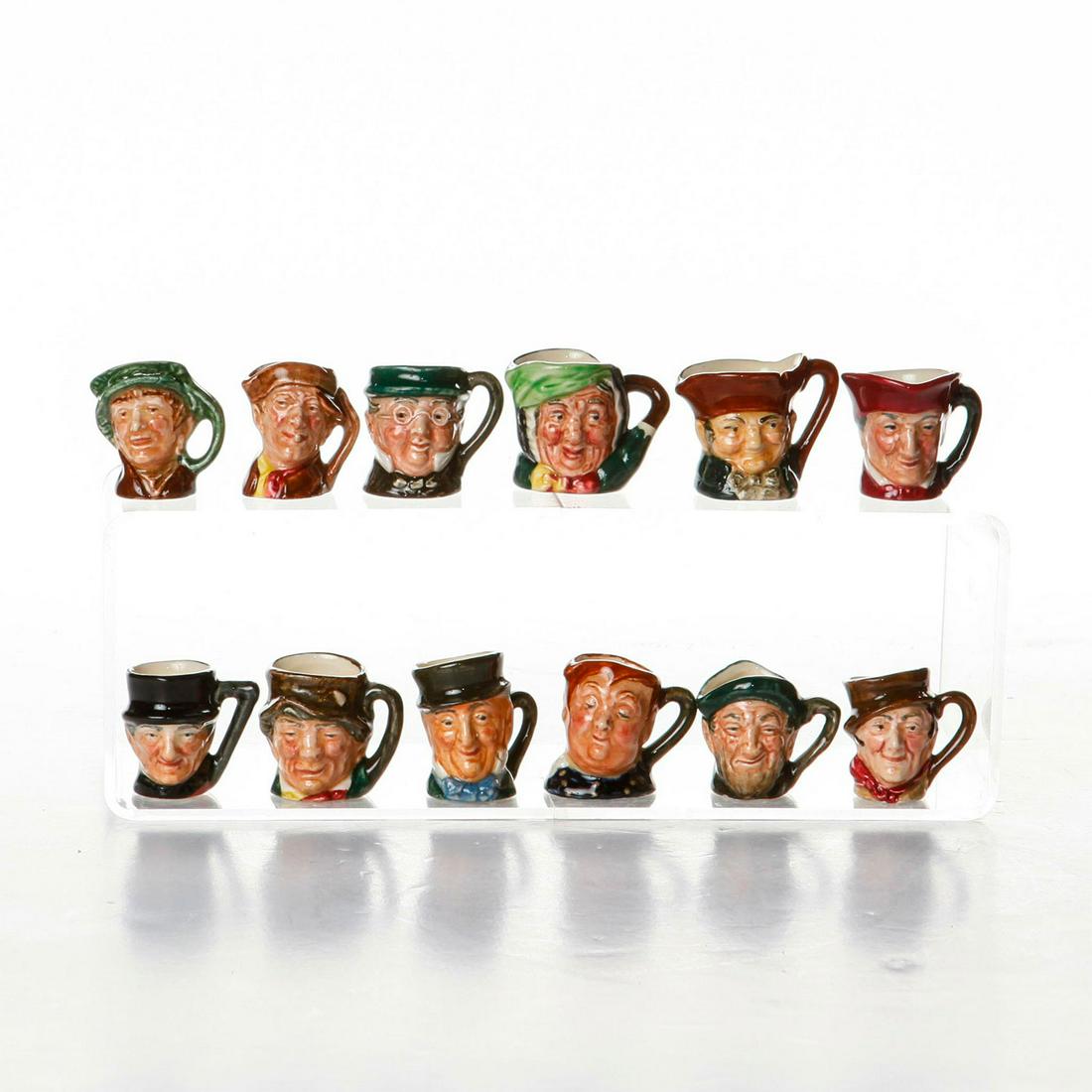 12 ROYAL DOULTON TINY CHARACTER JUGS: The Original Tinies set. Pieces stamped Royal Doulton to base. Includes Fat Boy, Mr. Micawber, Old Charley, Paddy, Sairey Gamp, Sam Weller, Arry, Arriet, Auld Mac, Cardinal, John Peel and Mr. Pickwick