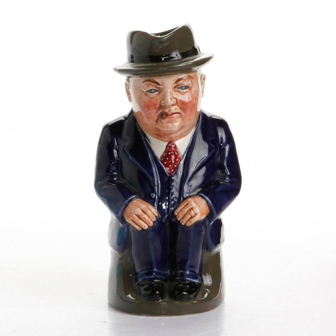 SMALL ROYAL DOULTON TOBY JUG, CLIFF CORNELL: Dark blue suit; red tie with cream polka dots. Ltd. Ed. of 500. Greetings Cliff Cornell; Famous Cornell Fluxes; Cleveland Flux Company stamped on underside. Issued: 20th c. Edition Size: 500 Manufactu