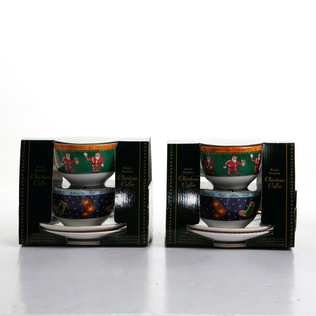 2 ROYAL DOULTON CHRISTMAS COFFEE GIFT SETS: 2 tea cups and saucers per set. Doulton backstamp. Issued: 1999 Dimensions: 6"H, tallest Manufacturer: Royal Doulton Country of Origin: England
