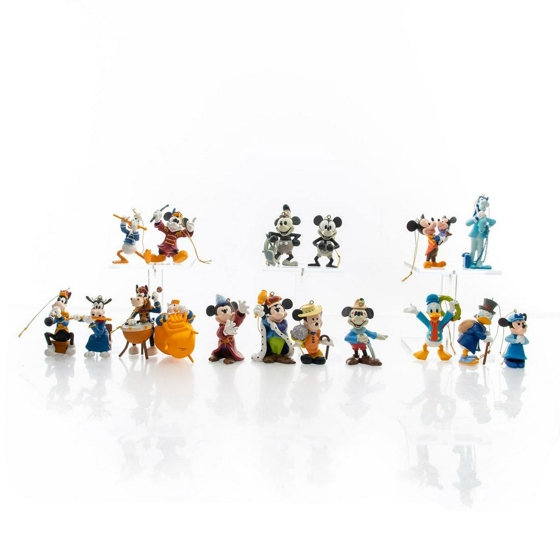 3 BOXED DISNEY MICKEY MOUSE CHRISTMAS ORNAMENTS: Band Leader, Mickey's Christmas Carol, Mickey Through the Years. Issued: 20th c. Dimensions: 12"L x 9.5"W, each box Country of Origin: China
