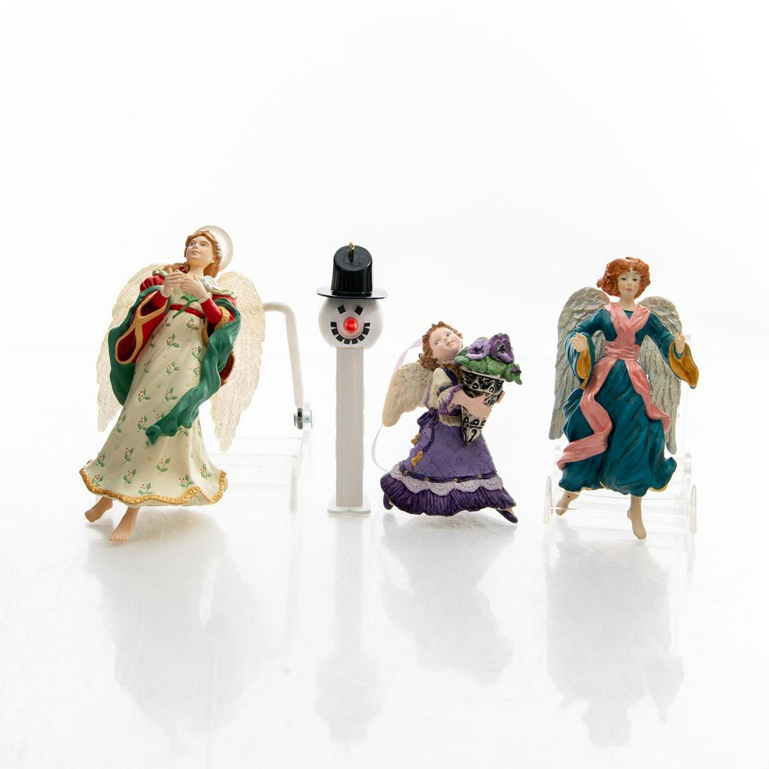 4 HALLMARK CHRISTMAS ANGELS AND PEZ ORNAMENTS: Angle Song, Glad Tidings, Pansy Angel, Pez Snowman. Issued: 20th c. Dimensions: 7"H, tallest Manufacturer: Hallmark