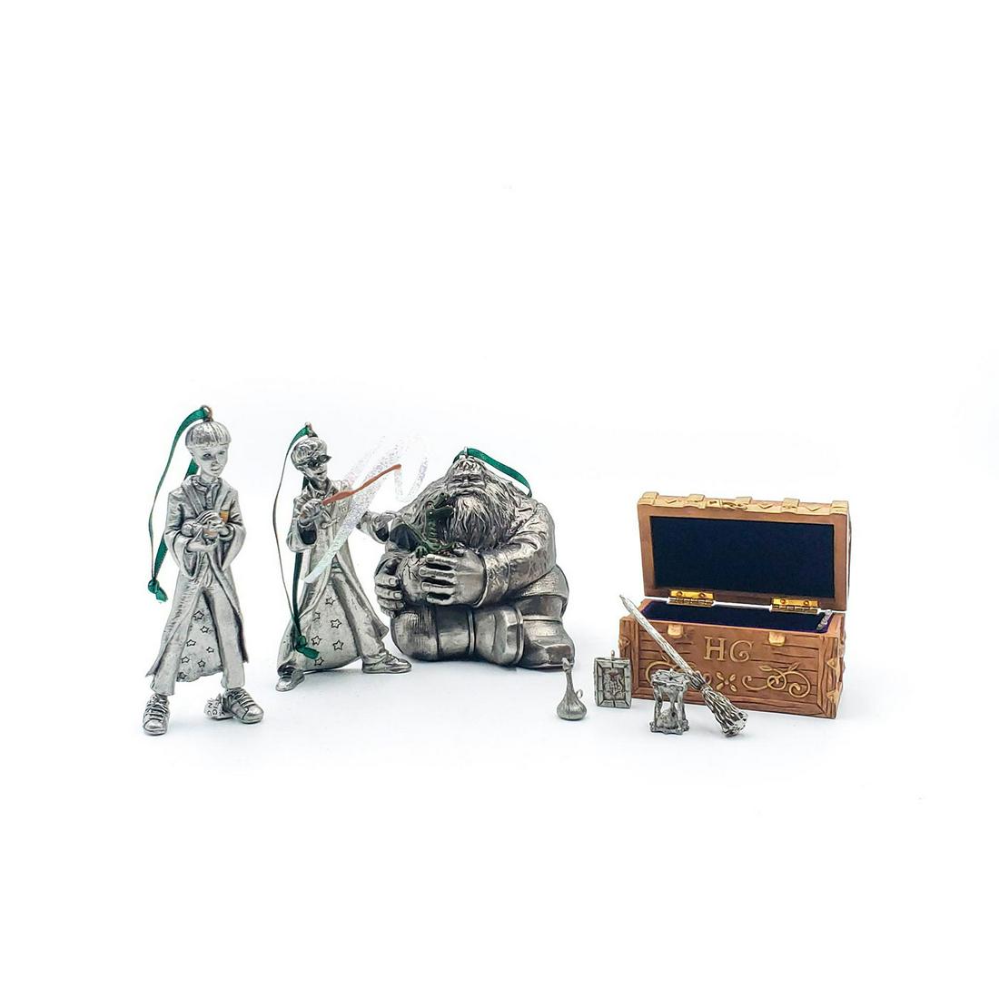 4 HARRY POTTER HALLMARK CHRISTMAS ORNAMENTS: Hagrid, Hermoine's trunk, Harry chooses a wand, Ron Weasley. In original packaging. Issued: 2001 Dimensions: 6.5"H x 5.5"W x 3.5"D, largest box Manufacturer: Hallmark Country of Origin: China