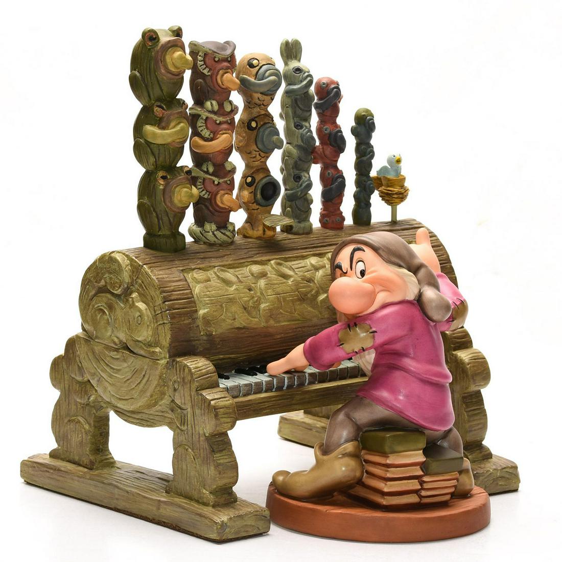 DISNEY CLASSICS SNOW WHITE FIGURINE GRUMPY & PIPE ORGAN: Sculpted ceramic dwarf, resin organ. Certificate of Authenticity. Stamped to bases WALT DISNEY CLASSICS COLLECTION. Certificate of Authenticity. Collectors box. Puppy 3"H; TV 6.75"H x 4.75"W. Issued: