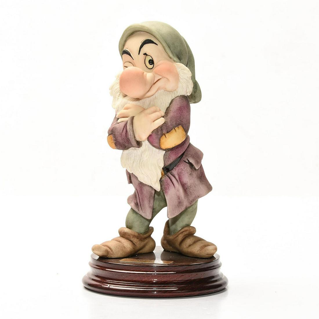 DISNEY GIUSEPPE ARMANI SNOW WHITE FIGURINE, GRUMPY: Artist signed, presented on decorative wooden base. DISNEY stamp. A Walt Disney special edition sculpture by Italian artist Giuseppe Armani (1935-2006) depicting an exquisitely detailed scene from the