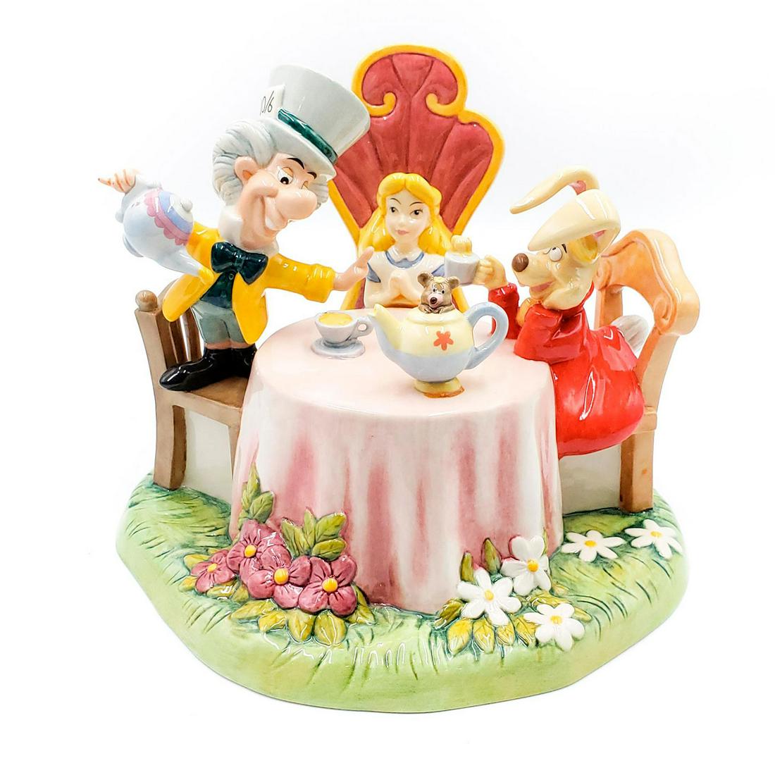 DOULTON DISNEY SHOWCASE FIGURINE MAD HATTER'S TEA PARTY: From the Disney classic Alice and Wonderland. Doulton backstamp. Issued: 20th c. Dimensions: 10"H Manufacturer: Royal Doulton Country of Origin: England