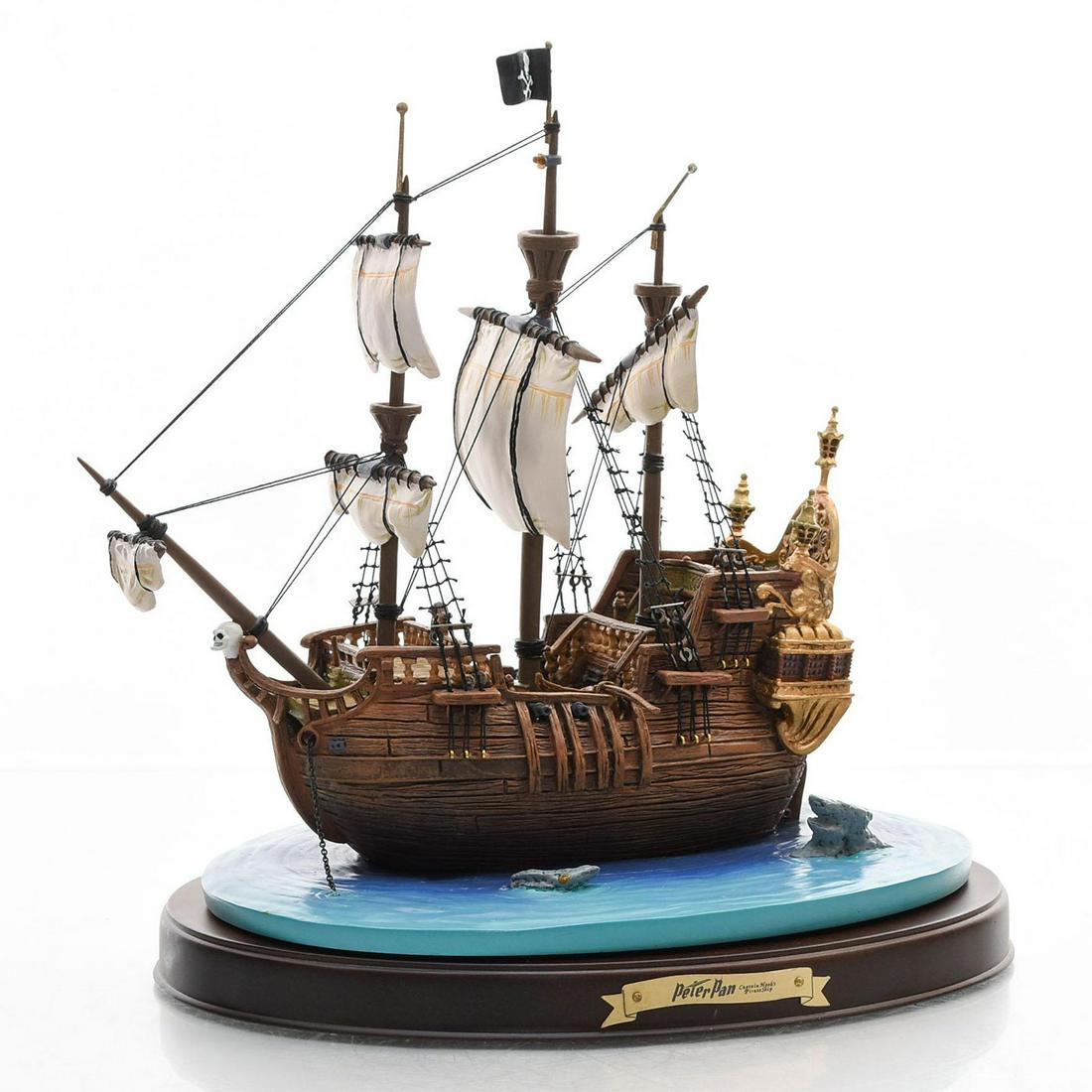 WALT DISNEY CLASSICS THE JOLLY ROGER PETER PAN SHIP: Hand made ceramic ship, with base. Disney Backstamp. Issued: 20th c. Dimensions: 15"W, largest Manufacturer: Disney Country of Origin: Thailand