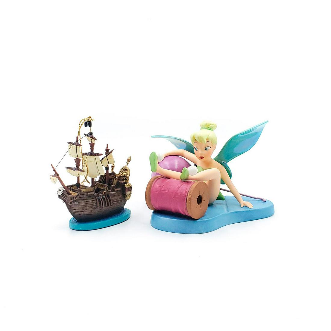 2 WALT DISNEY CLASSICS PETER PAN COLLECTION FIGURINES: Includes Little Charmer Tinker Bell and Jolly Roger ornament. Complete with Certificates of Authenticity and original boxes. Issued: 21st c. Dimensions: 7.5"L x 7.5"W, box Manufacturer: Walt Disney Co