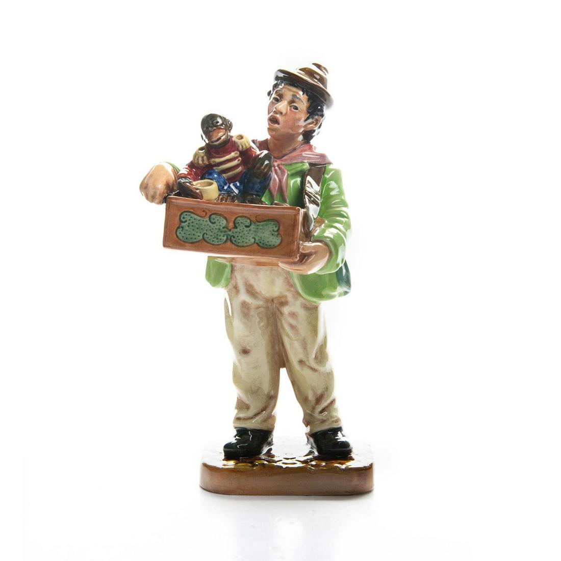 ROYAL DOULTON FIGURINE, ORGAN GRINDER HN2173: Green and cream colorway. Marked Royal Doulton on bottom. Artist: M. Nicoll Issued: 1959-1965 Dimensions: 9"H Manufacturer: Royal Doulton Country of Origin: England