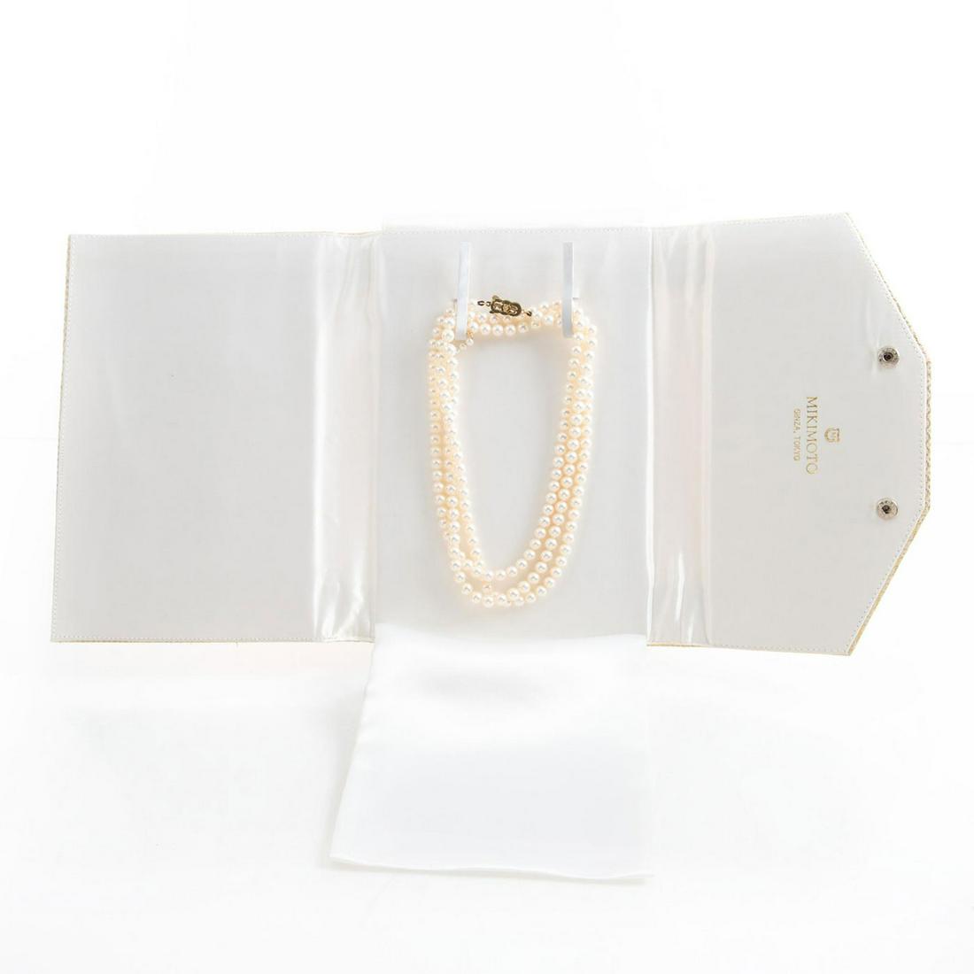 EXCEPTIONAL VINTAGE MIKIMOTO PEARL NECKLACE AND BROOCH: 43"L, 6mm Akoya pearls; 14k gold clasp inset with 1 pearl. Knotted strand. Luster is excellent. Color is white with soft rose overtones. Matching is excellent. The matching mini brooch/accent pin is 4