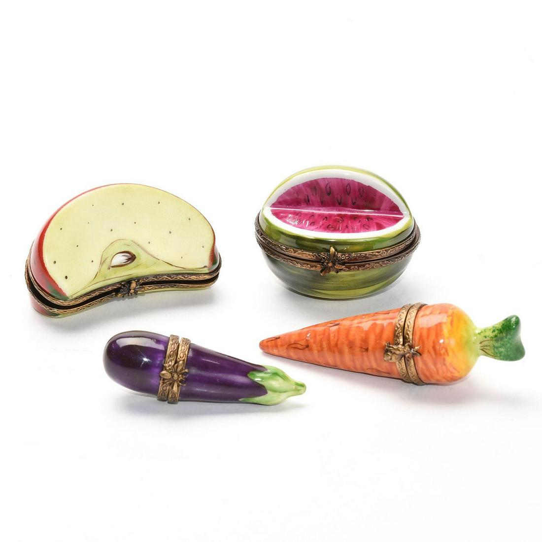 3 LIMOGES FRUIT AND VEGETABLES TRINKET BOXES: Handpainted; hinged boxes in the form of fruits and vegetables. Carrot, watermelon, eggplant and apple. Pieces marked Limoges. Issued: 20th c. Dimensions: 3"L, largest Manufacturer: Limoges Porcelain 