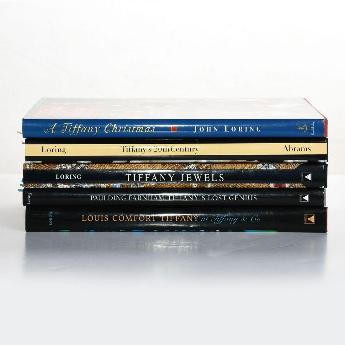 5 BOOKS ABOUT TIFFANY & CO., SIGNED BY JOHN LORING: Thousands of color images and hundreds of essays. Five hard cover books detailing the history and collections of American luxury jewelry and specialty retailer Tiffany & Co., founded in 1837, all sign