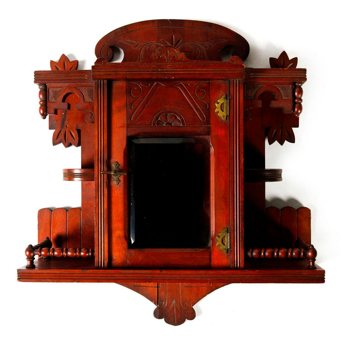 VICTORIAN DECORATIVE WOODEN VITRINE CURIO WALL CABINET: Glass front, with multiple shelves, hand carved. Issued: c. 1890 Dimensions: 22"H x 21"W Country of Origin: United States