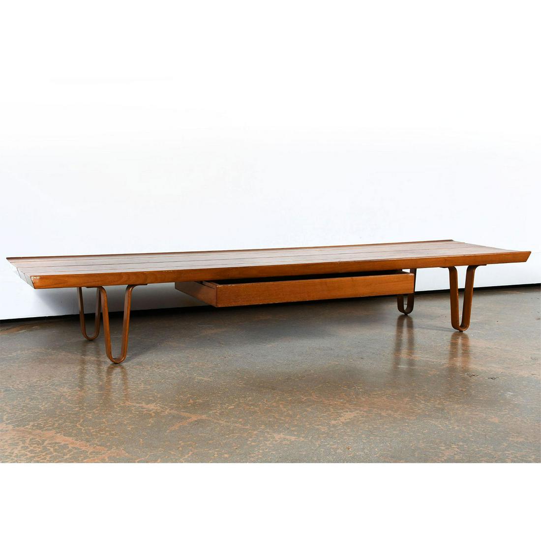 EDWARD WORMLEY DUNBAR LONG JOHN COFFEE TABLE MODEL 4699: Mid century modern design, with drawer and curved wood legs. Walnut construction. Drawer is labeled Dunbar furniture, Indiana. Some stains to finish. Artist: Edward Wormley Issued: 20th c. Dimensions: