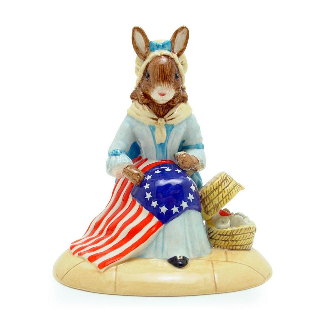 BETSY ROSS DB313 - ROYAL DOULTON BUNNYKINS: Royal Doulton Bunnykins, Betsy Ross Bunnykins DB313 (Pale blue dress; white collar and cap, red, white and blue flag, brown basket). Issued 2003 in a limited edition of 2,000. Size 4.25"H Issued: 2003