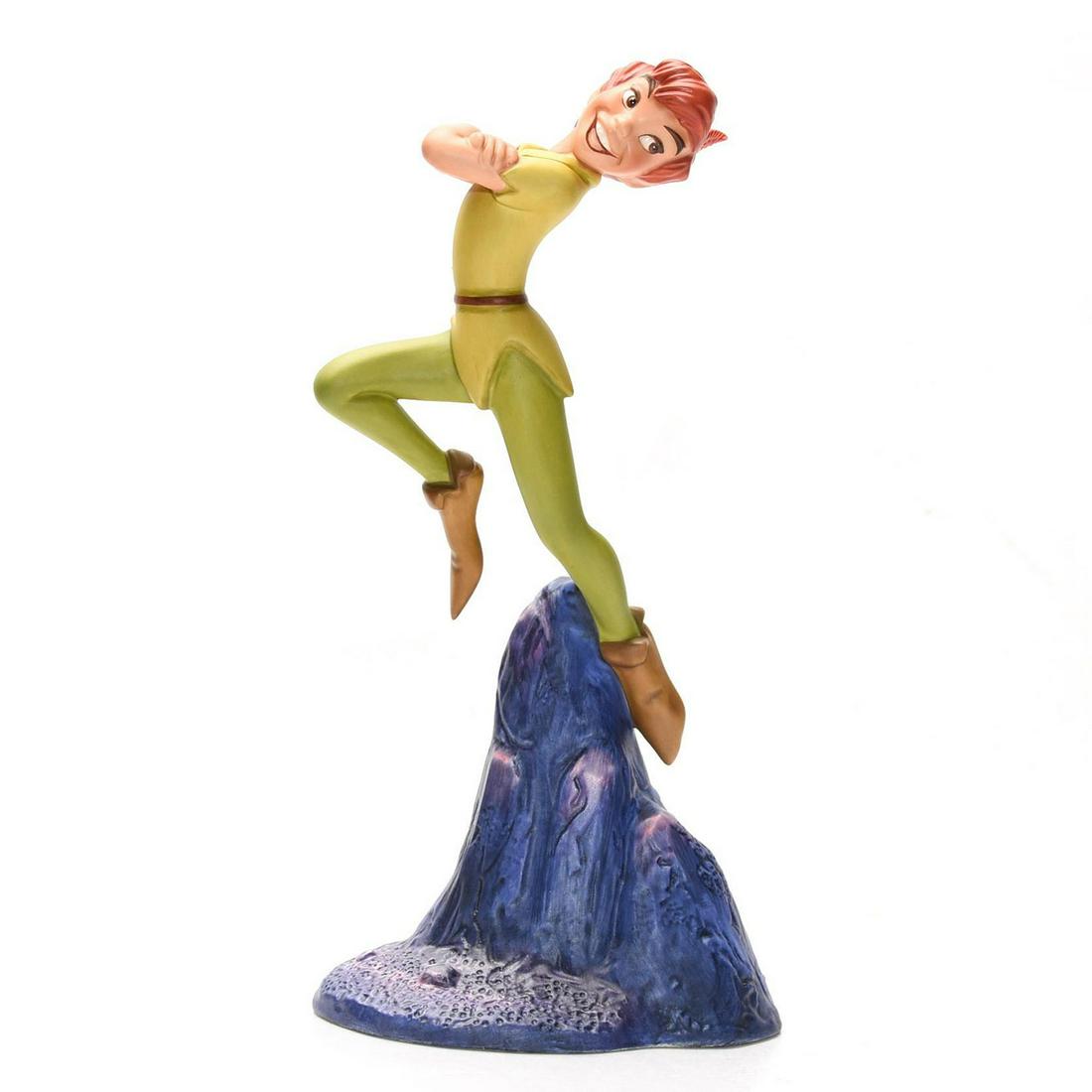 DISNEY CLASSICS FIGURINE, PETER PAN, CERTIFICATE & BOX: Modeled as the flying hero of the 1953 Disney animated feature. Stamped to base WALT DISNEY CLASSICS COLLECTION PETER PAN "NOBODY CALLS PAN A COWARD!" Certificate of Authenticity. Collectors box. Issu