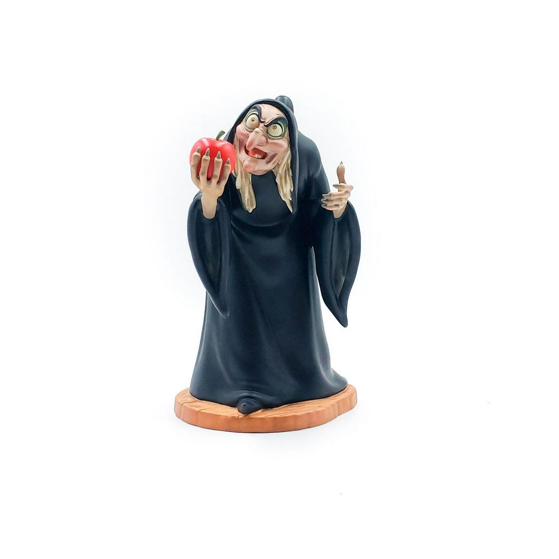 DISNEY CLASSICS FIGURINE, WITCH FROM SNOW WHITE: Take the apple, dearie. In original packaging. Issued: 1990s Dimensions: 7.75"H Manufacturer: Walt Disney Co.