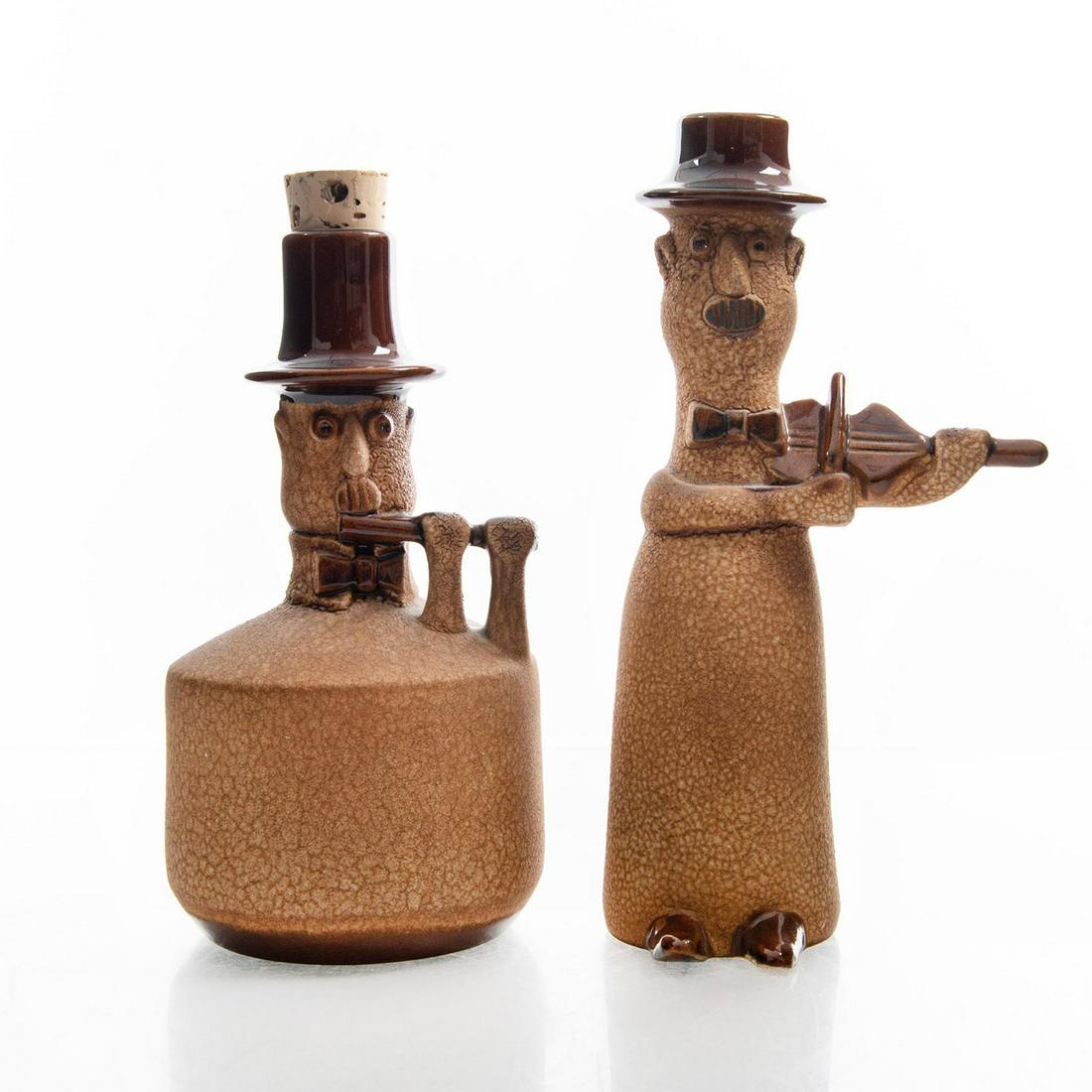 ROYAL HAEGER CERAMIC LIQUOR BOTTLES: Musicians w. violin and flute. Stamped Royal Haeger to bottom. Mid-century modern pottery from the iconic maker. These bottles were part of a larger Toe Tapper series by Royal Haeger. Dimensions: 9.5"