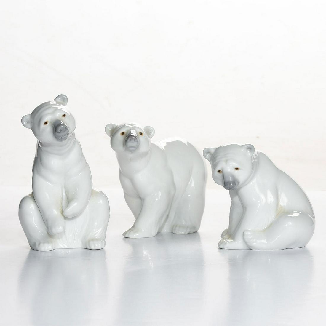 3 LLADRO FIGURINES, POLAR BEARS: Resting, sitting, and walking. Glossy white with gray noses. LLADRO HAND MADE IN SPAIN DAISA on the underside. Issued: 20th c. Dimensions: 5.5"H, tallest Manufacturer: Lladro Country of Origin: Spain