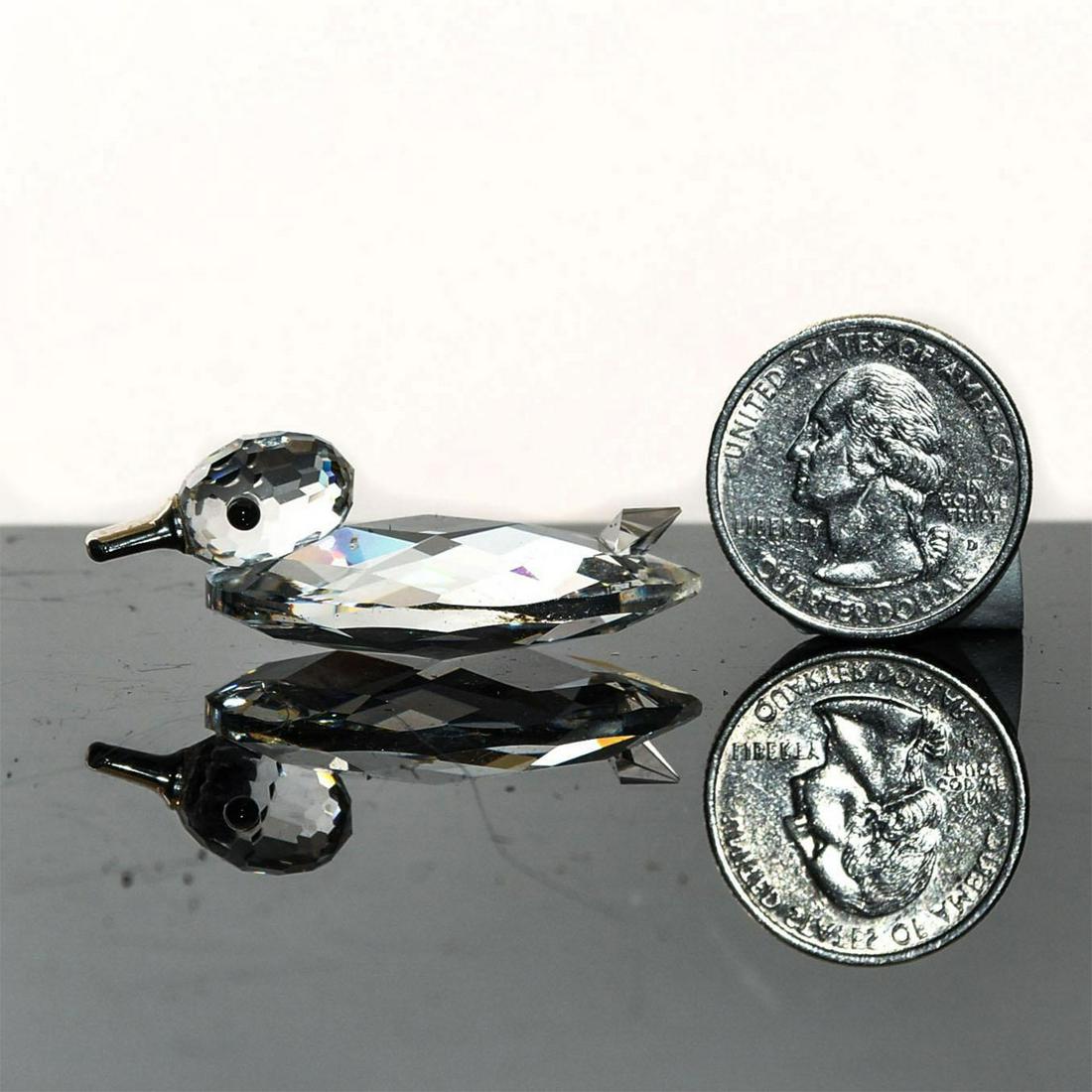 SWAROVSKI SILVER CRYSTAL FIGURE, MINI DUCK: Mini zoo series. Faceted body w. metal bill and black eyes. 2"L. Complete with original box. Artist: Max Schreck Issued: 1980 Dimensions: 5"H x 3.5"W, box Manufacturer: Swarovski Country of Origin: Au
