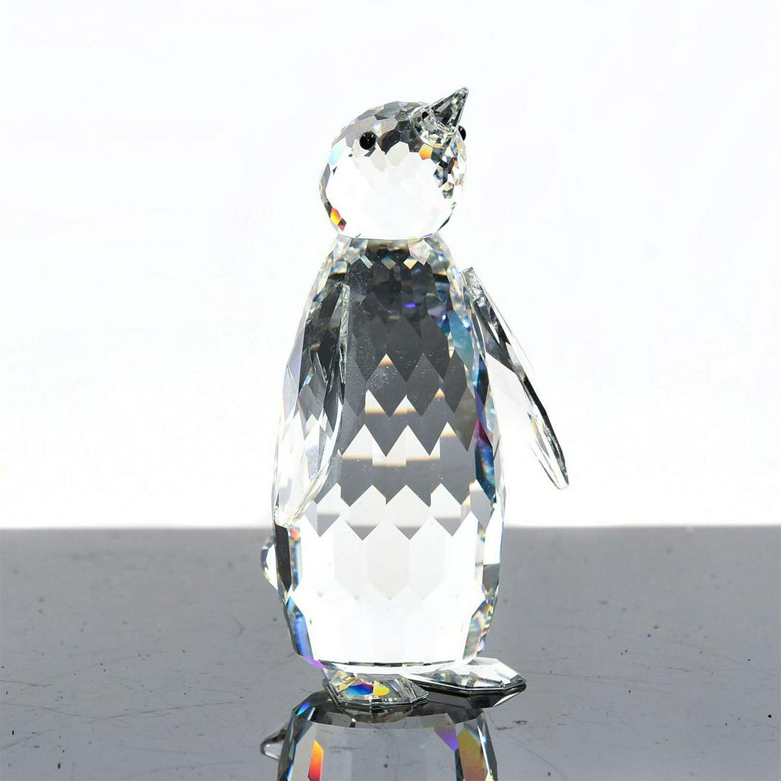 SWAROVSKI SILVER CRYSTAL FIGURE, PENGUIN: Kingdom of Ice and Snow series. Clear, black eyes. 3.25"H. Artist: Max Schreck Issued: 1984 Dimensions: 3.25"H Manufacturer: Swarovski Country of Origin: Austria