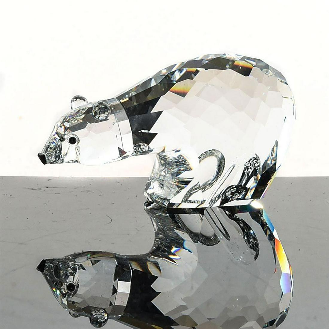 SWAROVSKI SILVER CRYSTAL FIGURE, POLAR BEAR: Kingdom of Ice and Snow series. Clear, black eyes and nose. 3.5"L. Complete with box. Artist: Adi Stocker Issued: 1986 Dimensions: 6.25"H x 3.5"W, box Manufacturer: Swarovski Country of Origin: Austri