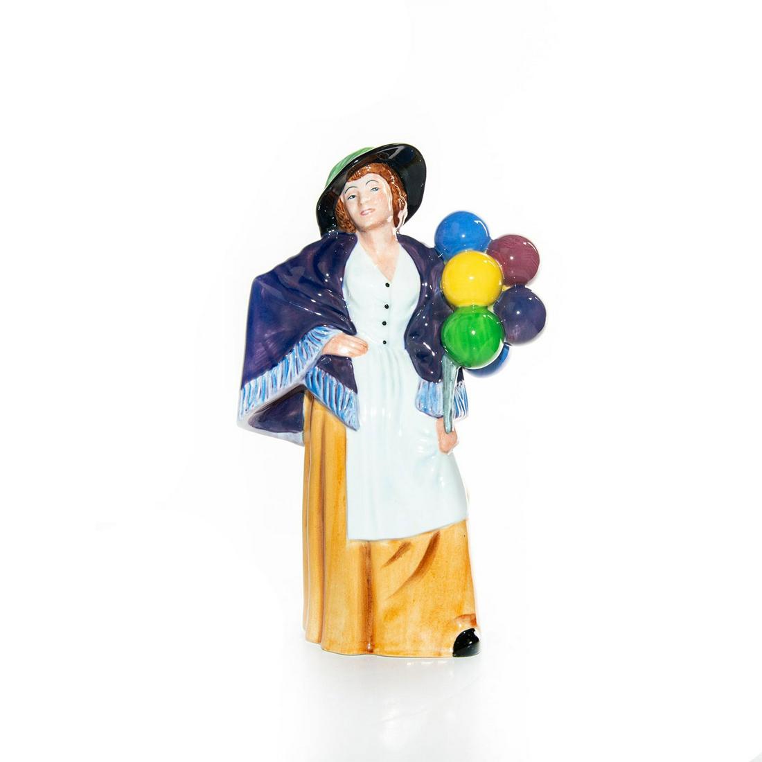 ROYAL DOULTON FIGURINE, BALLOON LADY HN2935: One in a series of Royal Doulton balloon sellers, Balloon Lady stands anxiously awaiting her next customer. - Balloon Characters Artist: Peter Gee Issued: 1984 - 2009 Dimensions: 8.25"H Manufacturer: 