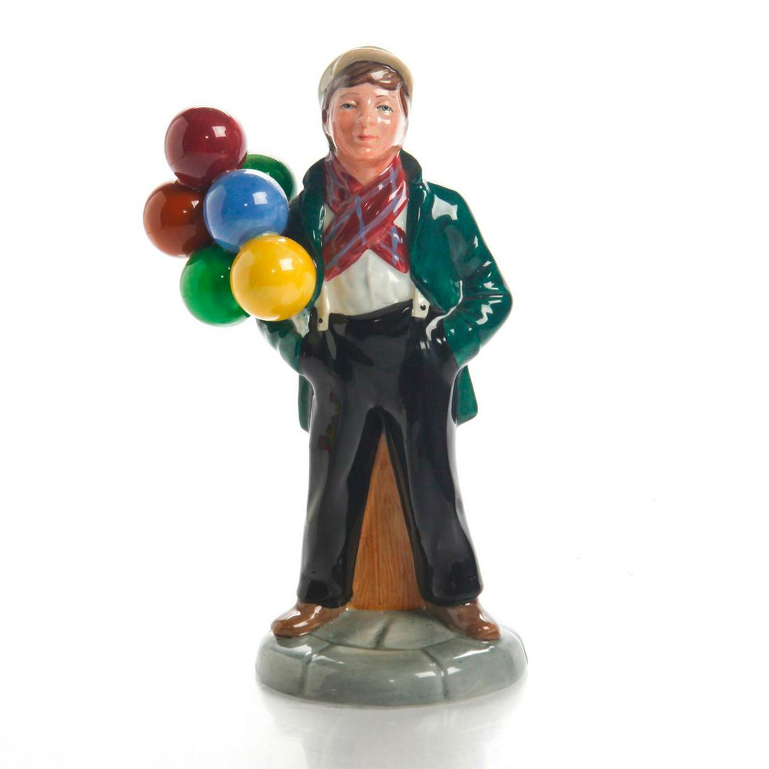 ROYAL DOULTON FIGURINE, BALLOON BOY HN2934: Young Edwardian street seller reminiscent of Charles Vyse models. A glazed ceramic Royal Doulton figurine, modeled as a young street seller and hearkening back to the early 20th century models designe