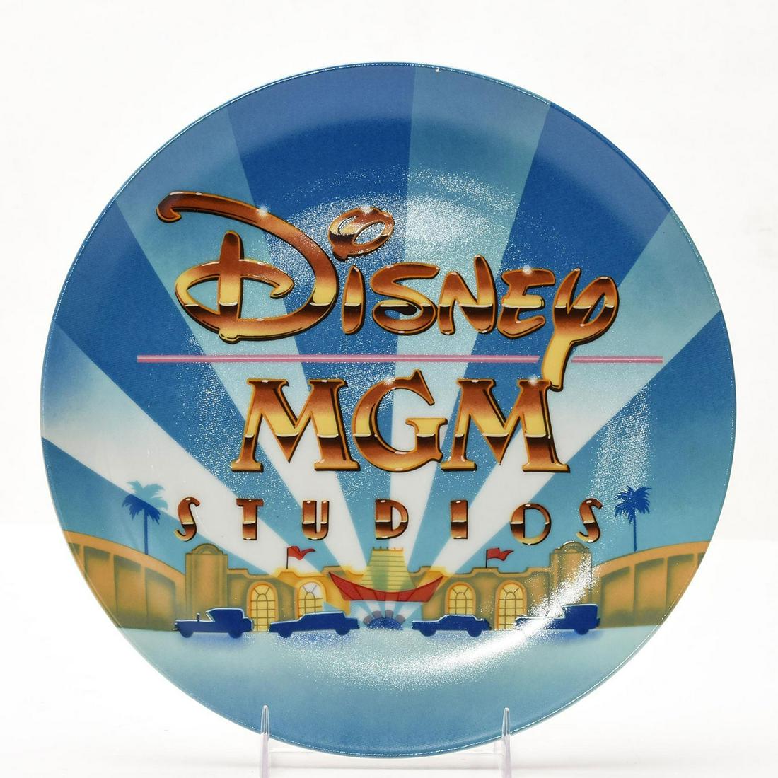 WALT DISNEY WORLD MGM STUDIOS COMMEMORATIVE PLATE: Stylized and hand decorated. Collectors box. DISNEY backstamp. Issued: 1987 Dimensions: 9.5"D Manufacturer: Disney Country of Origin: United States