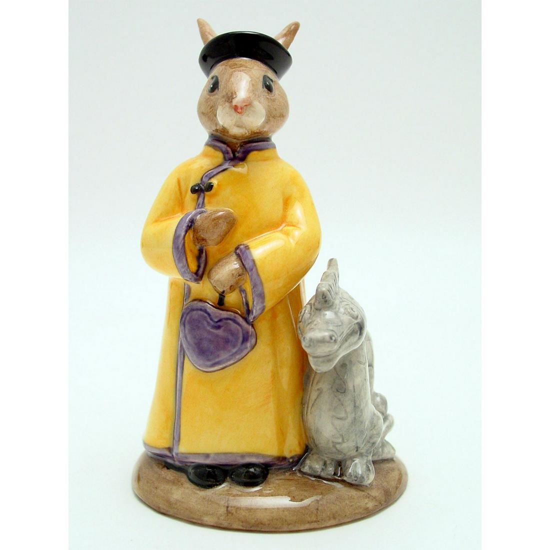 ROYAL DOULTON BUNNYKINS FIGURINE, MANDARIN DB252: Royal Doulton Bunnykins, Mandarin Bunnykins DB252 (yellow robe with blue trim, grey dragon). Designed by Caroline Dadd, issued in 2001 in a limited edition of 2,500. Size 4.25"H Artist: C. Dadd Issued
