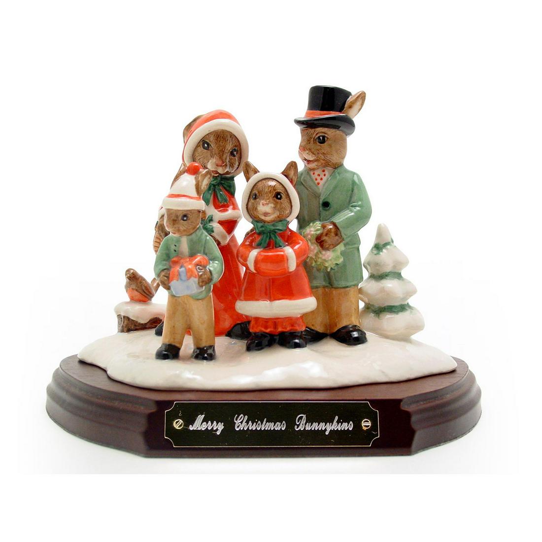 ROYAL DOULTON BUNNYKINS FIGURINE, MERRY CHRISTMAS: Royal Doulton Bunnykins, Merry Christmas Bunnykins Tableau DB194 (brown, green, red, white and black coloration). Designed by Caroline Dadd, Issued 1999 in limited edition of 2,000. Size 7.25" by 5.5"