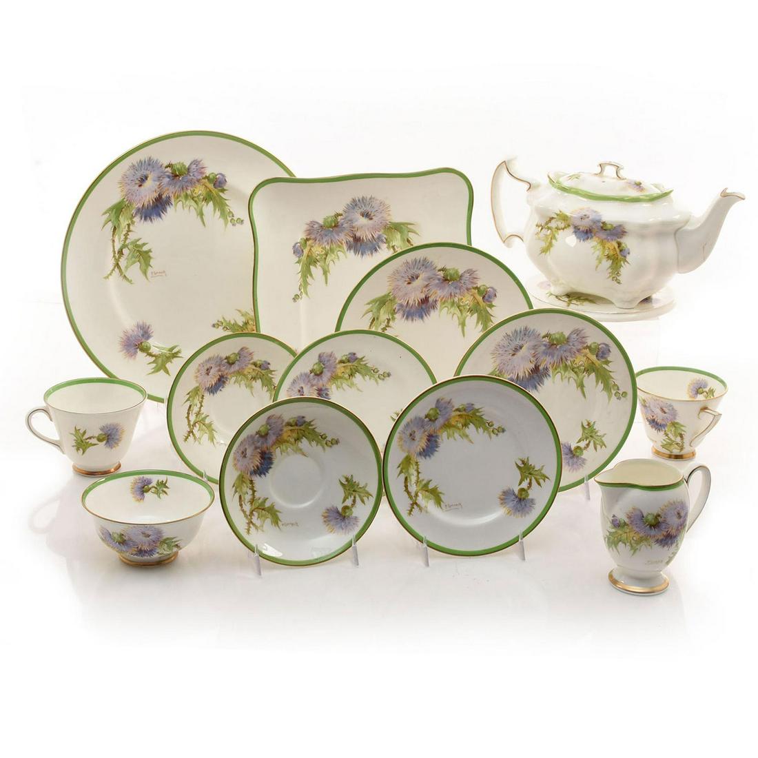 44 PC. ROYAL DOULTON CHINA SET, GLAMIS THISTLE H4601: Signed by P. Curnock. Hand painted in purple, green, with gilt. 3 dinner, 4 salad, 18 dessert, 14 cups, 9 saucers, creamer, teapot, 1 small bowl, trivet. Found Near Glamis Castle Home of the Queen Mot