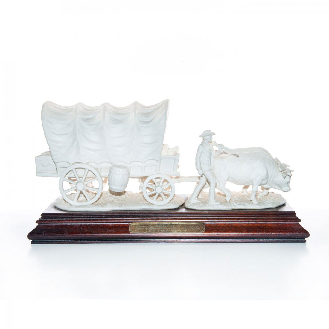 GOEBEL MONUMENTAL AMERICANA FIGURE, WESTWARD BOUND: Limited Edition. White bisque. Artist signed by Gerhard Skrobek. An exemplary monumental Goebel white bisque porcelain group figurine depicting western pioneers leading oxen and a covered wagon. Comme