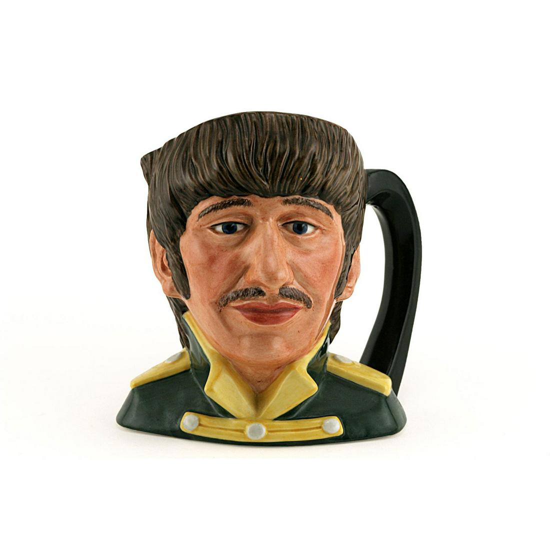 RINGO STARR D6726 - ODD SIZE - ROYAL DOULTON CHARACTER: Royal Doulton Character Jug, Ringo Starr D6726 (black tunic; yellow collar and epaulettes). Designed by Stanley J. Taylor. Series: The Beatles, issued 1984 - 1991. Size: 5.5"H (odd)Richard Starkey (b.